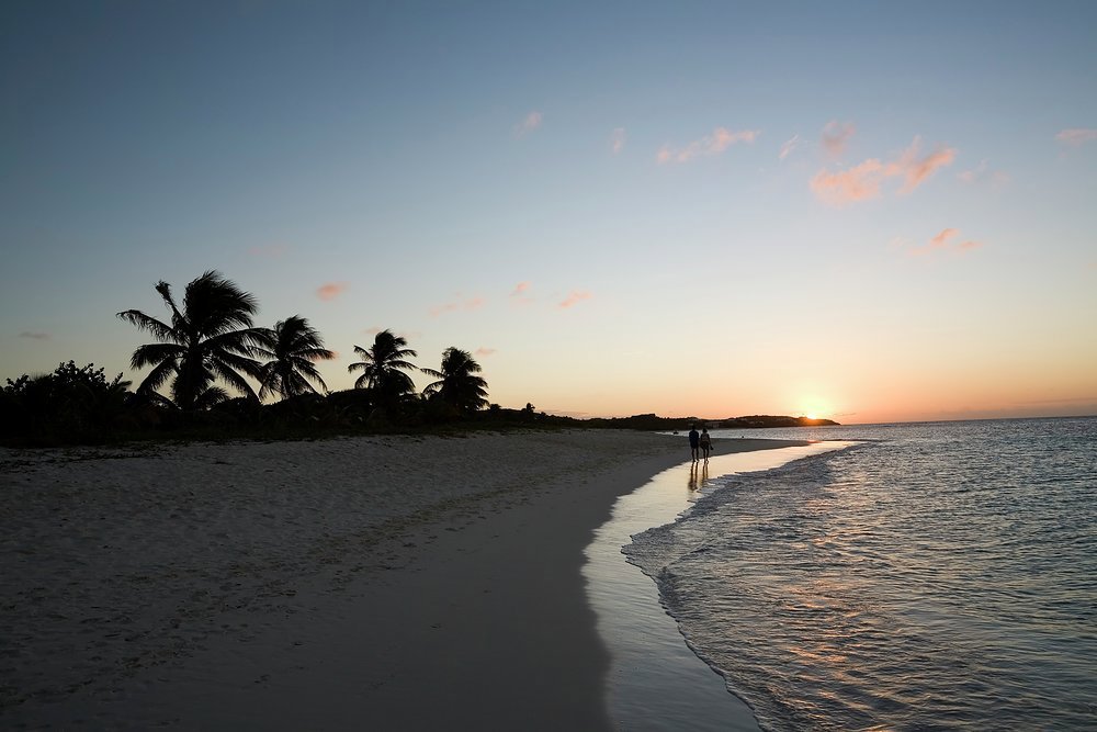 While the crew sets up the beach BBQ for your romatic waterside dining, stroll together along the cool sand as the sun sets