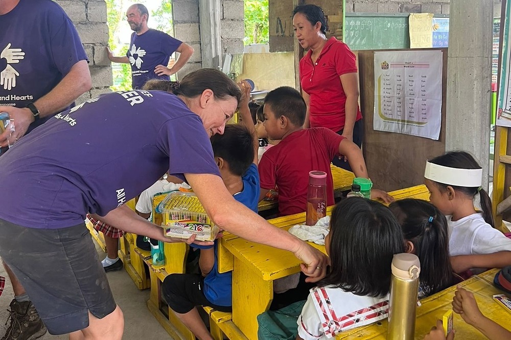 Our team took our crayons and school supplies. School is all that the children have, and they love it!