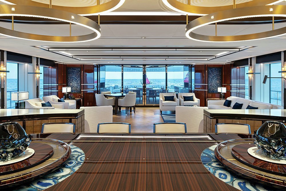 Looking aft from the dining table showing the vast windows that let in so much natural light