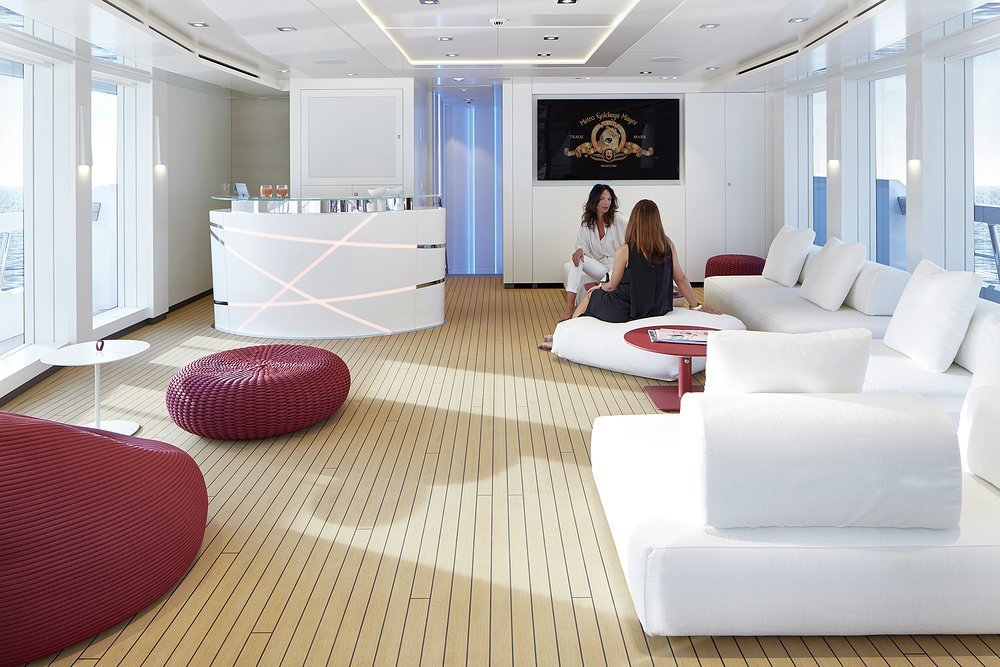 Teak decking and full-height windows in the sky lounge bring the outside in