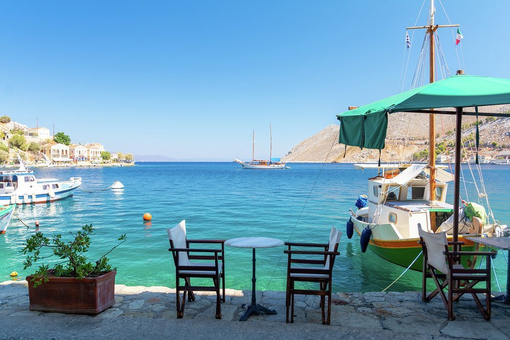 An idyllic taverna scene on a peaceful fishing quay