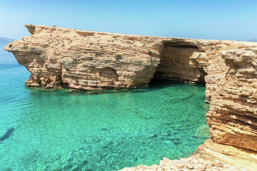 Stunning waters surround the Ksylobatis Caves on Ano Koufonisi in the southern Cyclades