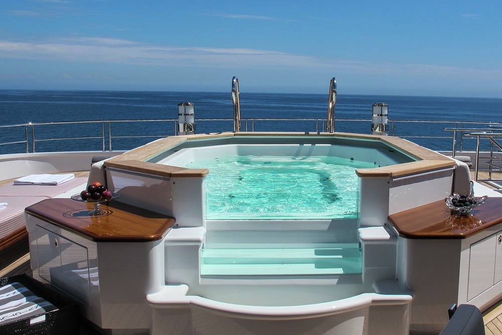 Find the glass-fronted jacuzzi on the spacious sun deck