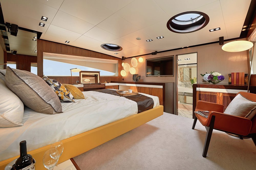 The split-level owner's suite with steps into the bathroom forward