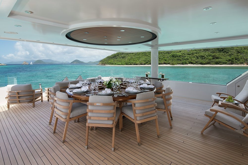 The bridge deck aft has open air dining and a lounge area with infinity views through glass guardrails