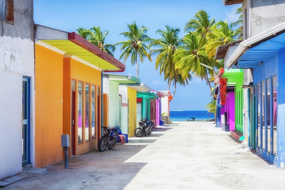 Behind the exquisite resorts, local towns are bright and bustling