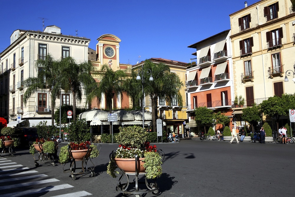 Sit in the piazza, order a coffee and enjoy the bustle