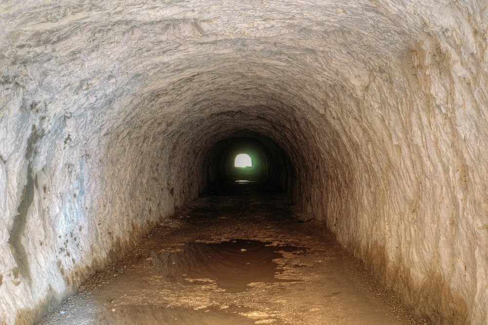 ...passes through two tunnels hewn through the rock...